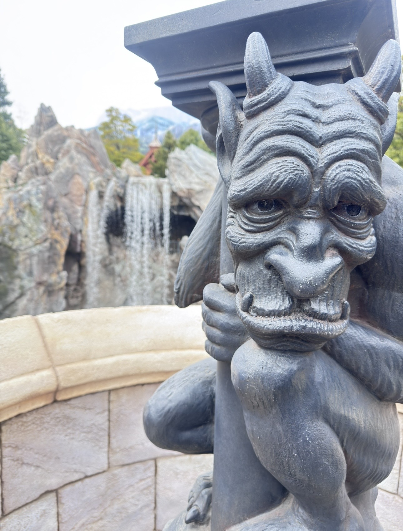 Gargoyle Beast statue with waterfall
