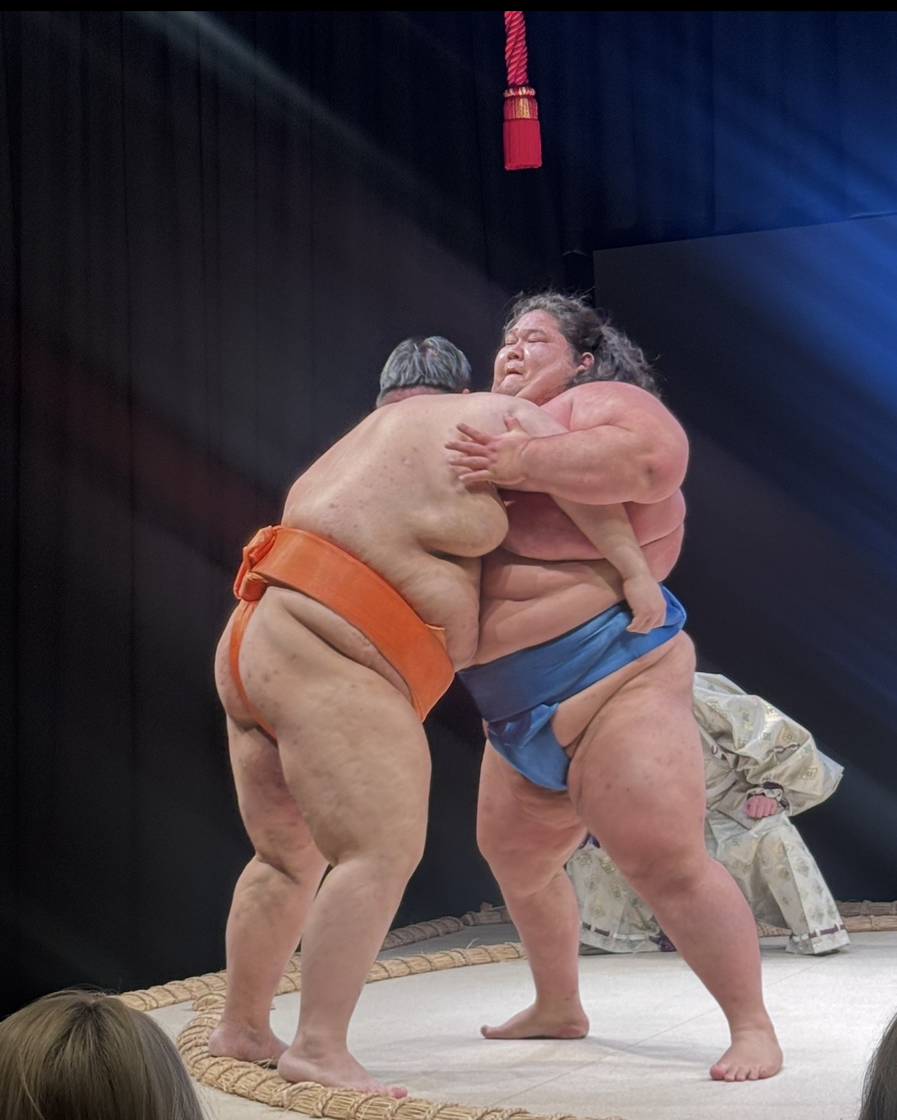 Two sumo wrestlers grappling