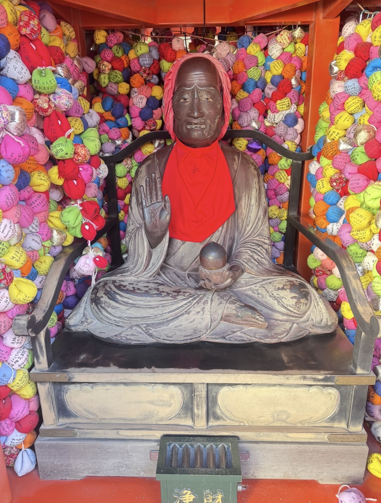 Yasaka Koshindo Buddha with colorful kukurizaru balls